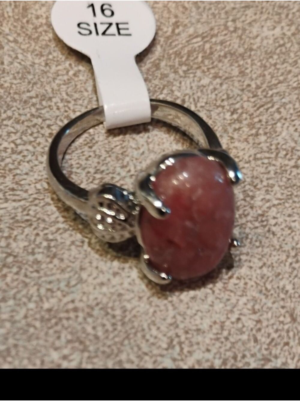 Silver Pink Rhodochrosite ring features a vibrant gemstone set in  four-prongs